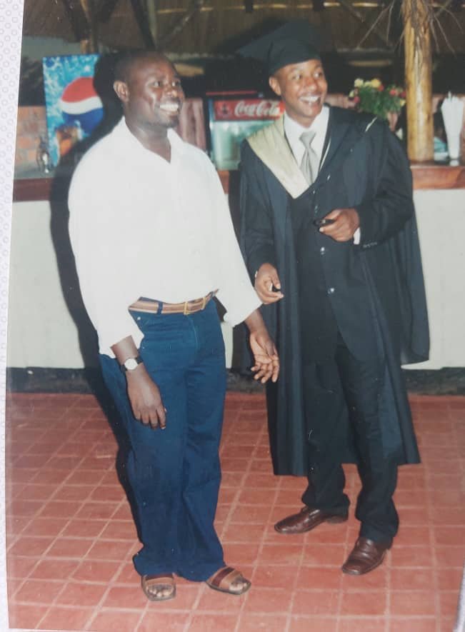 At my graduation party with close friend and my senior in Lumumba, Lawyer Moses Kamoga