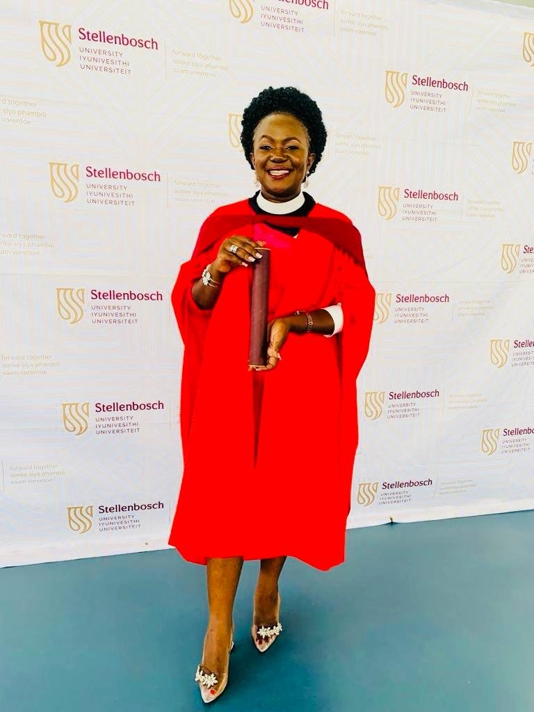 Copy of Rev. Dr. Lydia Nsaale Kitayimbwa with her PhD Award at Stellenbosch University.