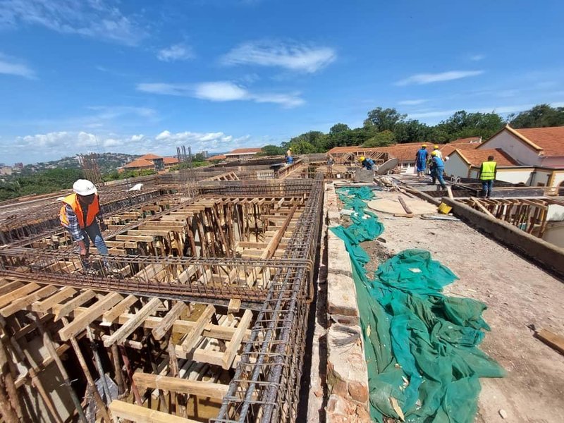 Excel Site Engineer Vivian Namboozo inspects works on the upper floors during the Main Building&#x27;s reconstruction.