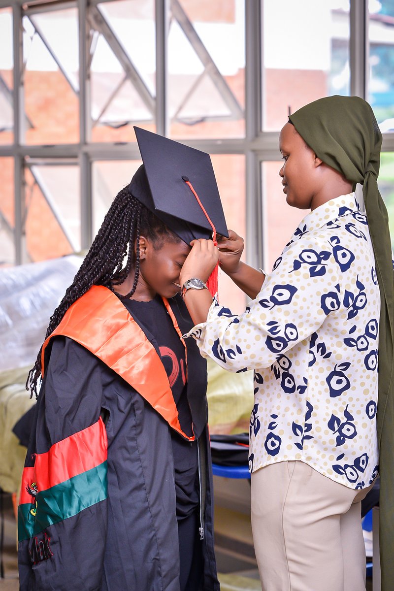 Graduands doing fitting for their gowns before graduation day 4