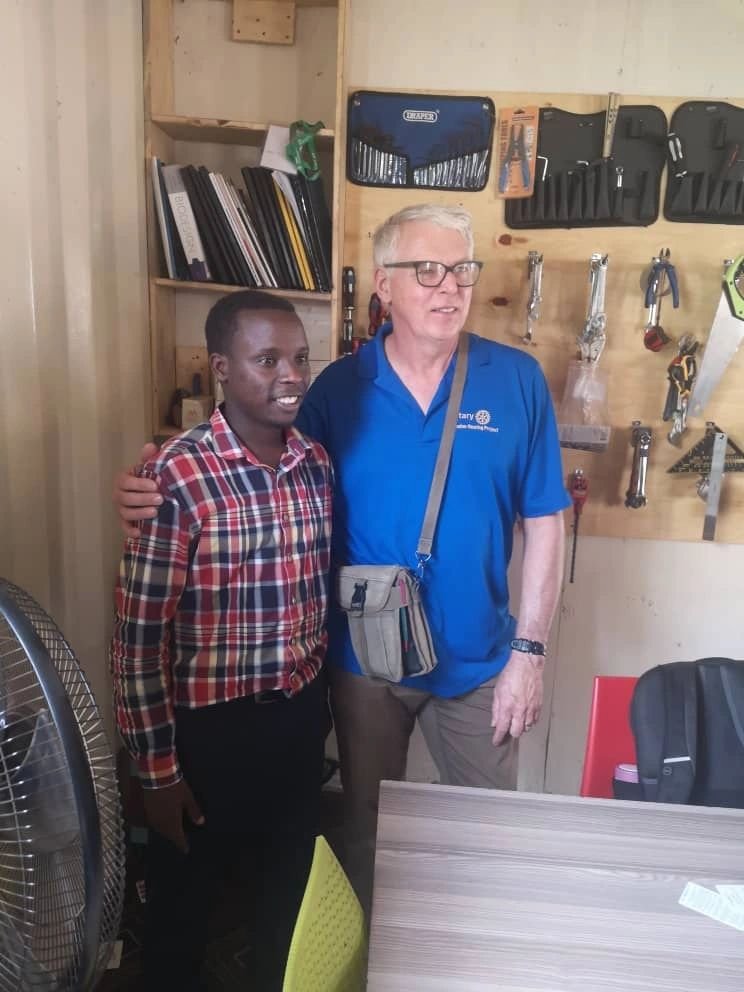 Julius Mugaga with Mr Mike Crean from the Rotary club of New Westminster, Canada