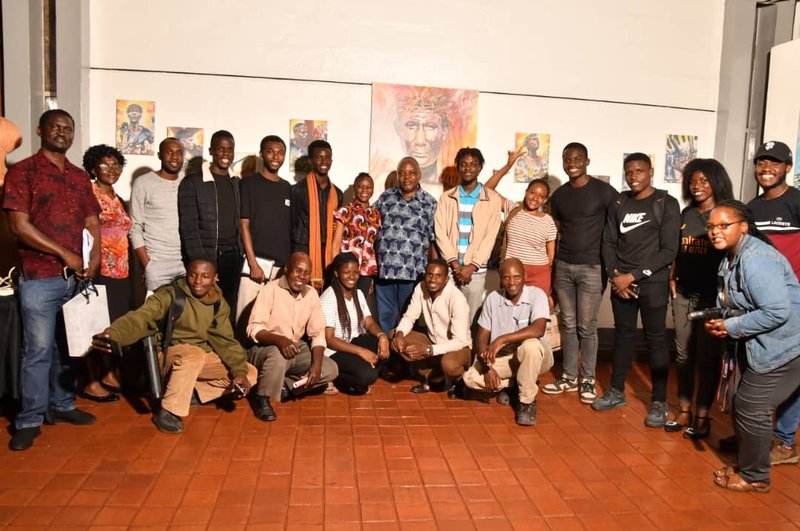 Leonard Kateete (Centre) with Guests at his 2024 Exhibition. Photo by Neeson Musa