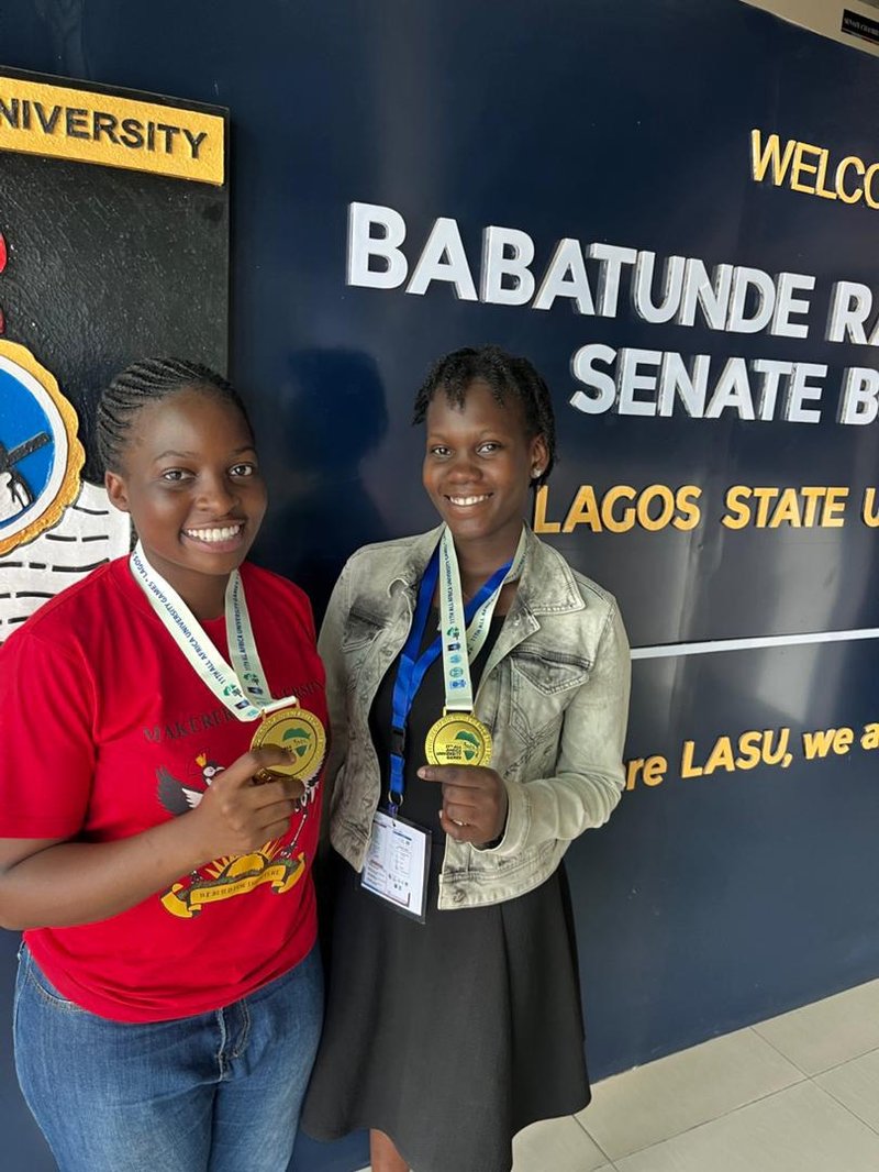 Margaret Nassiwa and Anne Luggya show off their Gold medals they won from the Chess events