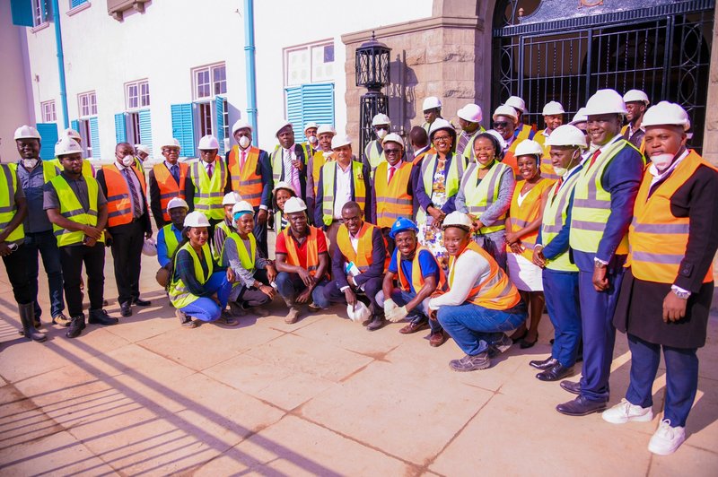 Members of Council pose for a group photo with contractors at the Main Building Entrance on 25th July 2024.