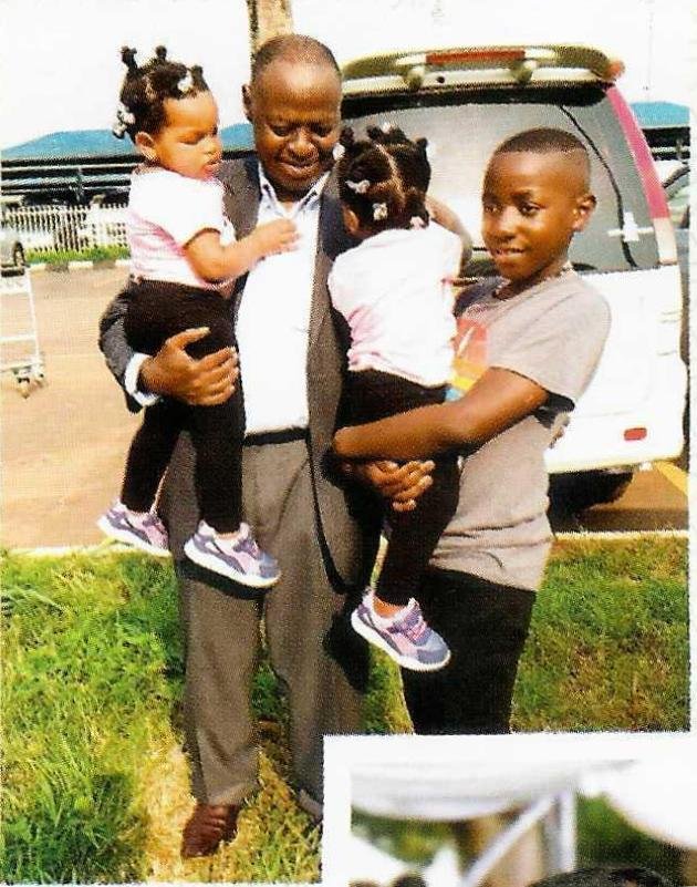 Prof. Khiddu Makubuya with his grandchildren.